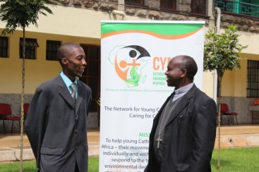 Allen Ottaro and Bishop Wainaina smile as they speak outside